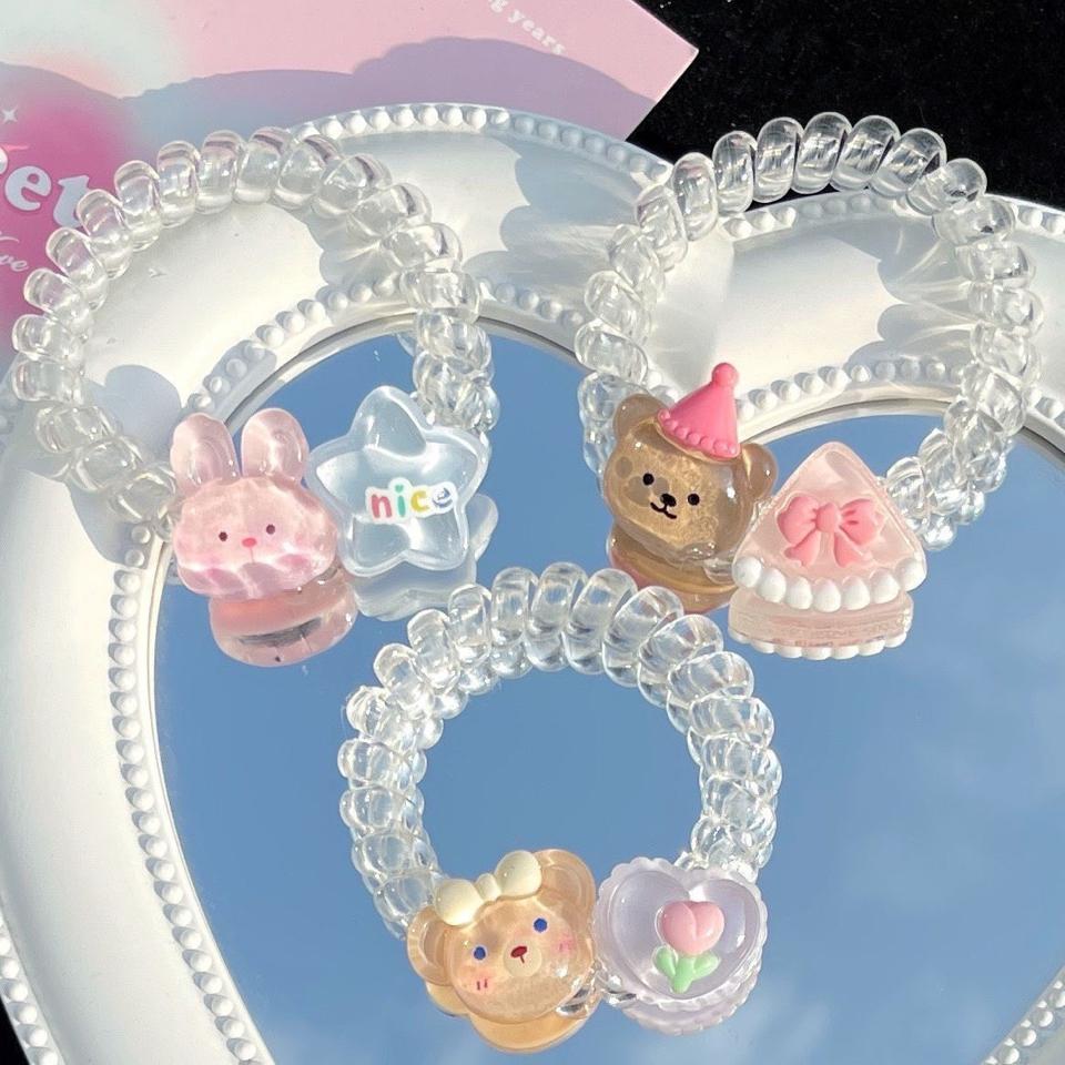 Cột tóc lò xo trong suốt 2 charm-duoc-ban-tai-Sin Sin Shop