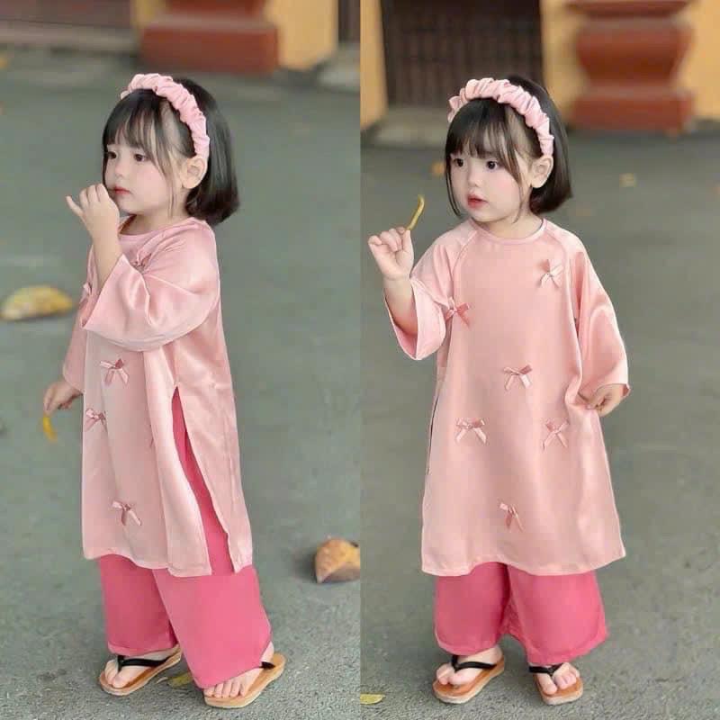 Áo Dài hồng đính nơ-duoc-ban-tai-Kho sỉ quần áo