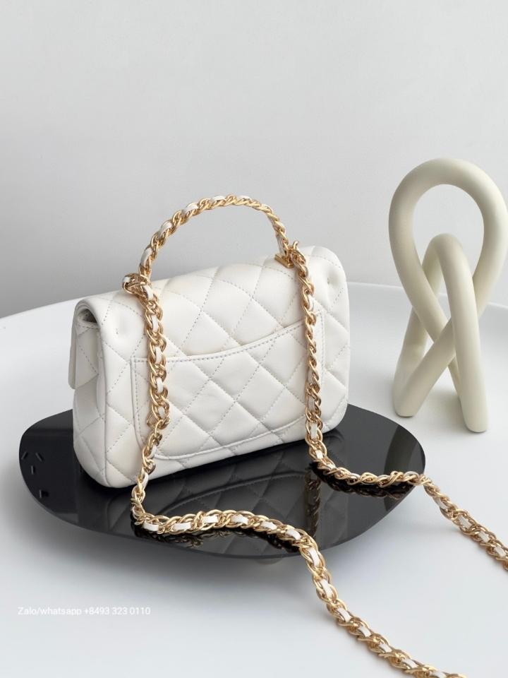CHANEL MINI FLAP BAG WITH TOP HANDLE
Shiny Lambskin Gold-Tone Metal
White  C2 -duoc-ban-tai-Hvip Bags & Accessories